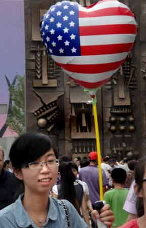  “American Balloon in China” people ©2010 Maria Sky, All Rights Reserved<br><p>A boy at the 2010 Shanghai Expo holding a heart shaped American Flag balloon. 