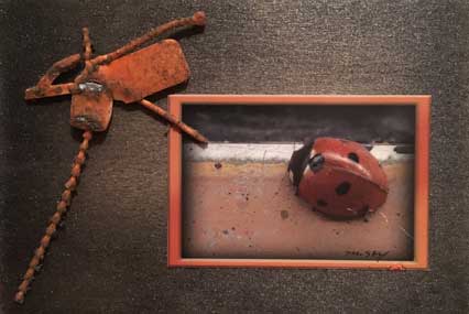  “Ladybug” 4x6 in., mixed media, ©2018 Maria Sky, All Rights Reserved <p>An orange squashed plastic “bug”was found in a parking lot and was included with the framed ladybug. This work was part of a series of 4x6 inch artwork shown at the Pajaro Valley Arts Council Exhibition.</p>