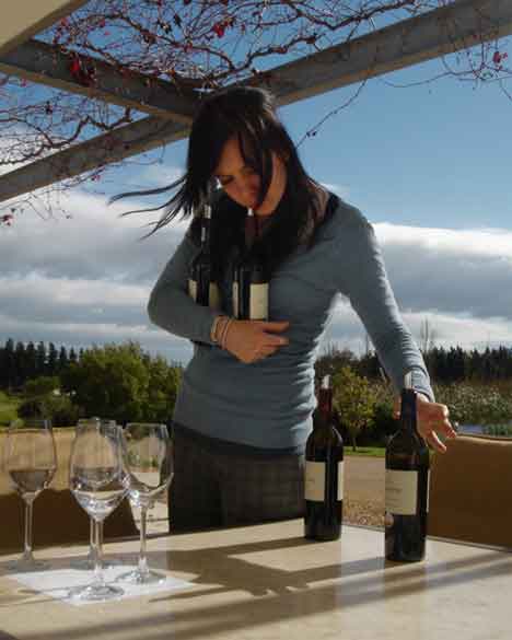  &ldquo;Serving Wine in South Africa&rdquo; people &copy;2007 Maria Sky, All Rights Reserved<br><p>My daughter and I visited South Africa in 2007. A gentle breeze was blowing the server's hair as she gathered her bottles of wine.